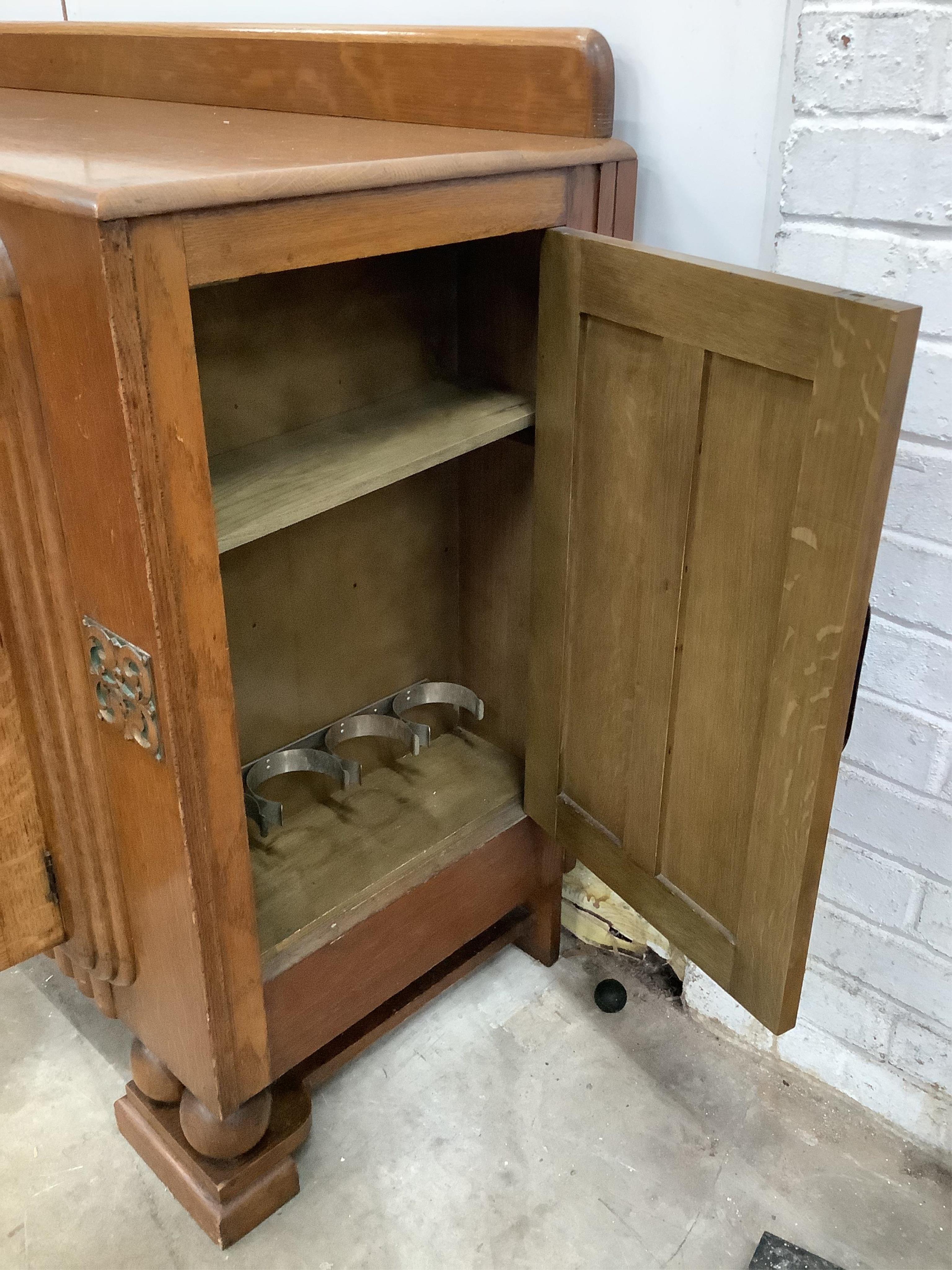 A French Art Deco oak sideboard, width 153cm, depth 52cm, height 99cm. Condition - good